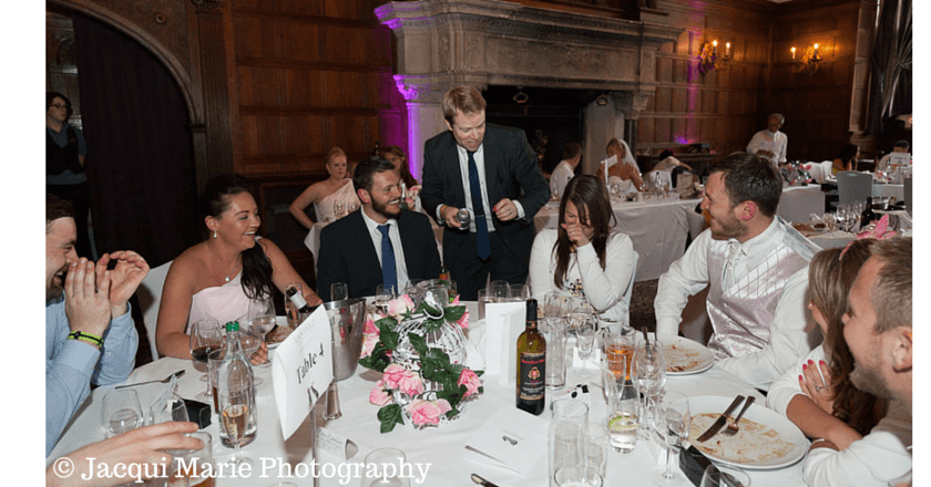 Wedding entertainment close-up magician Roger Lapin performing in the Grand Hall at Rhinefield House